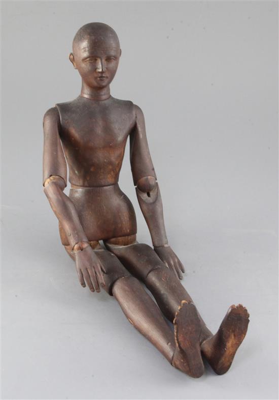 A late 19th / early 20th century carved wood artists lay figure, 19.25in.